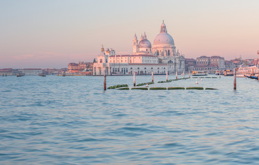 Grand Canal and Basilica Santa Maria della Salute in Venice at surise, rose-colored.