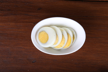 Sliced boiled egg on a white plate