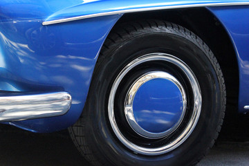 Obraz na płótnie Canvas Car wheels close up on a background of asphalt. Car tires. Car wheel close-up