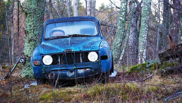 Abandoned car in forest