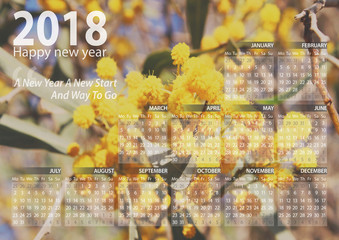 calendar 2018 happy new year with mimosa flower background