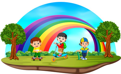 Obraz na płótnie Canvas Children playing in the park on rainbow day 