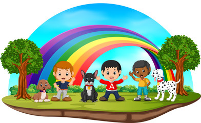 Obraz na płótnie Canvas Children and dogs in the park on rainbow day 