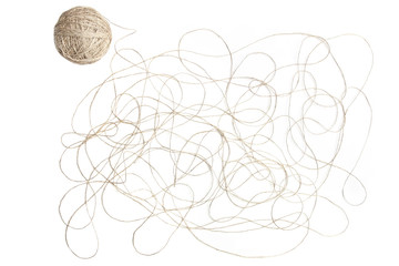 Abstract background with linen thread and thread ball. Chaotic weave of grey thread isolated on white background.