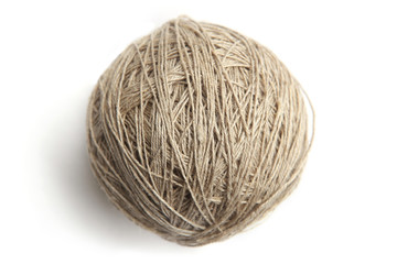 Linen thread ball isolated on white background. Ball of grey natural linen string top view.