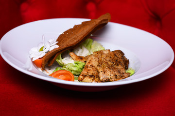 Dinner served on traditional plate. Main course and catering