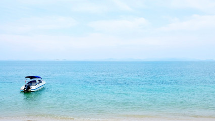 Fototapeta premium Speedboat, beach, coastline and blue sky