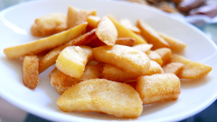 Potato fries on the light brown basket dish