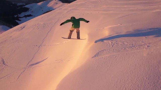 Aerial view of snowboarder in action