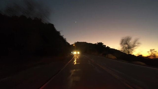 Night rear view driving time lapse on Box Canyon road between Los Angeles and Simi Valley in Southern California. 