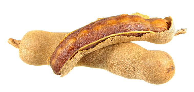 Group of raw tamarind fruits isolated on white background