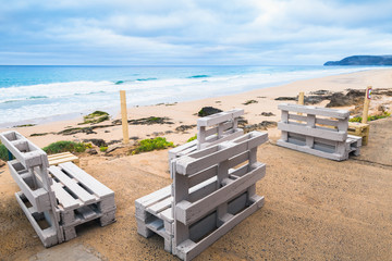 Standard white wooden furniture on a beach