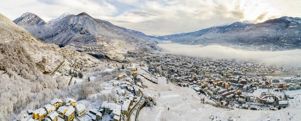 Valtellina (IT) - Vista aerea panoramica invernale di Sondrio e frazioni
