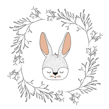 bunny face with closed eyes in decorative frame of branches in color silhouette