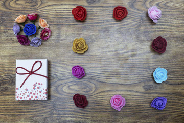 Lovers holidays. 14th february. Gift box with group of roses over wooden table. Top view with copy space