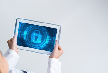 Close of female doctor hands working with tablet pc computer