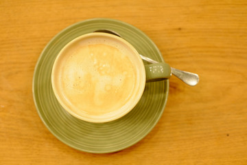 Hot coffee cup on wood table decorative working and meeting concept selective focus on coffee cup