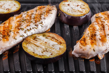 Fillet of chicken breast and eggplants cooked on electrograss. Proper nutrition home cooking