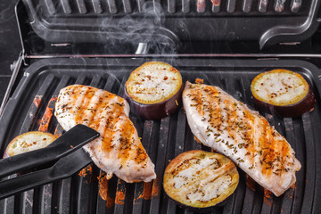 Fillet of chicken breast and eggplants cooked on electrograss. Proper nutrition home cooking
