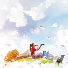 Concept of careless happy childhood with girl looking in future