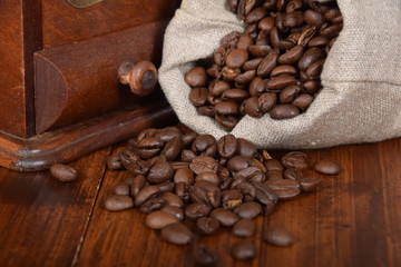 gray bag with roasted seeds of black coffee with free space for text