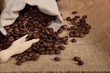 gray bag with roasted seeds of black coffee with free space for text