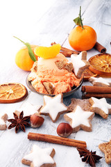Winter Ice cream with gingerbread and tangerines, on wooden background