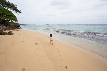 Child Playing on Beach in Oahu Hawaii