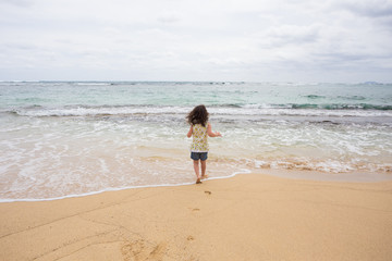 Child Playing on Beach in Oahu Hawaii