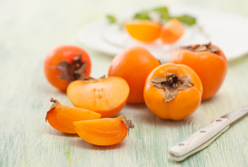The sliced persimmons on the kitchen table