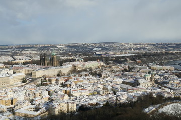 Fototapeta na wymiar Panorama of Prague Cathedral and City skyline in winter snow