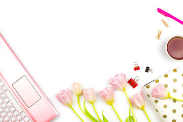 Flatlay with pink tulips, a laptop, cup of tea and other accessories. Spring business mockup, white background