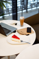 dessert cheesecake, coffee and laptop