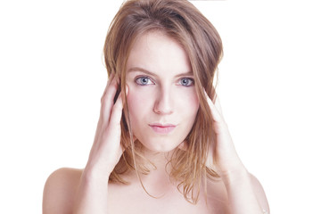 Fototapeta premium Positive blonde woman looking to the camera. Isolated, over a white wall.