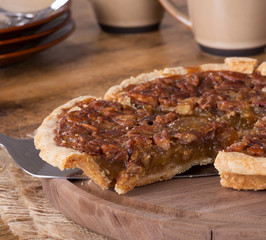 Sliced Pecan Pie on a Wooden Platter