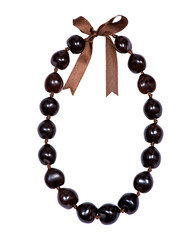 Hawaiian lei necklace of dark brown kukui nuts