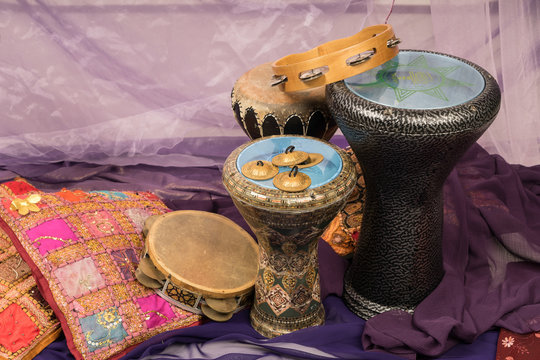Side view of musical instruments of a bellydance percussiongroup with darbuka's, tambourines and zills