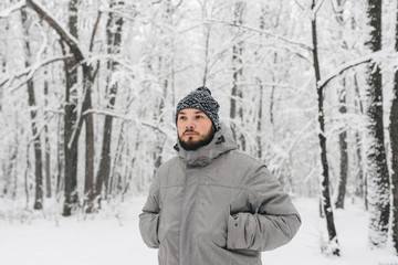 Fototapeta na wymiar a man in a snowy forest