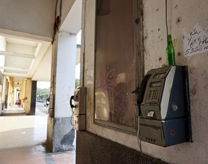 Vintage pay phones in corridor.