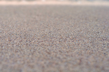 Background with Background with sea sand close-up with a blurred focus on the edgessea sand