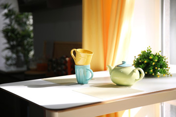 Tea set on table in kitchen