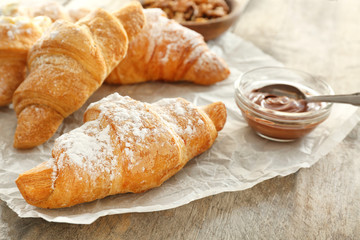 Tasty croissants on table, closeup