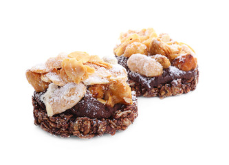 Tasty praline cakes on white background