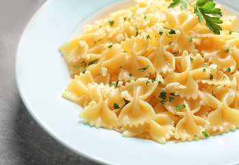 Delicious pasta with garlic and parsley on plate