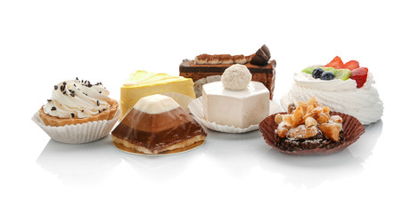 Assortment of tasty pastries on white background