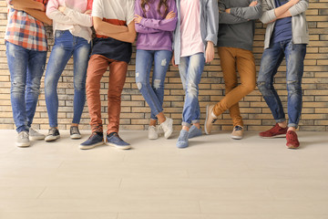 Naklejka premium Group of cool teenagers indoors