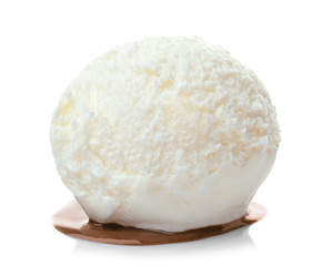 Ice cream ball with caramel sauce on white background