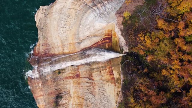 Aerial of Large Waterfall Over Rough Water