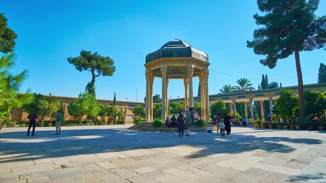 The locals and tourists visit the Tomb of Hafez - architectural complex, located in Mussala gardens and dedicated to the medieval Persian poet, Shiraz, Iran