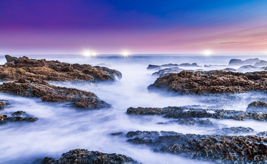 Milky Sea Water over Rocks at the Coast